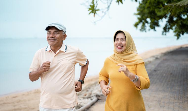 Muslim mature couple doing jogging together stock photo
