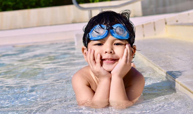 Boy in Pool with goggles