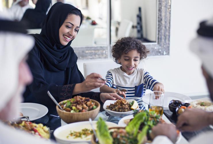 family meal; hijab woman