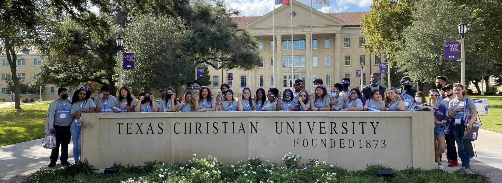 tcu tour students in front of tcu main building
